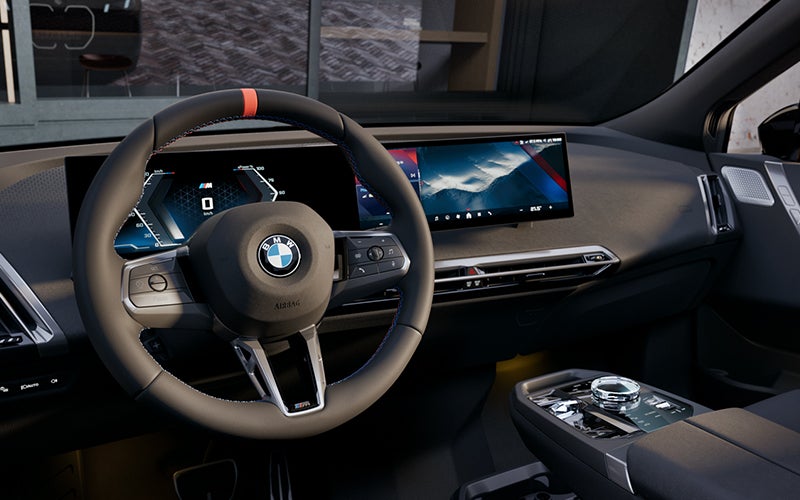 Interior steering wheel and dashboard of the BMW iX M70. | BMW of Devon in Devon PA